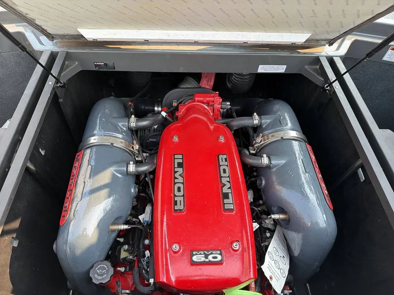 Slide: The Image of The engine compartment of a 2015 MasterCraft X30 features a red Ilmor 6.0 engine. - 10