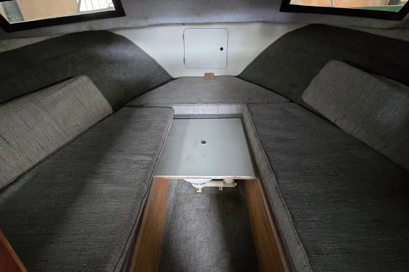 Slide: The Image of Interior cabin of a 1989 SportCraft 270 Fisherman boat with gray seating. - 17