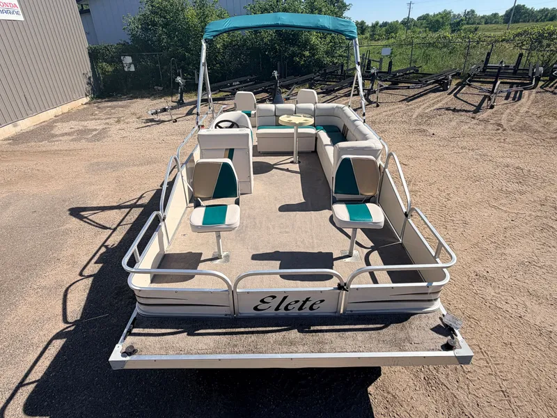 Slide: The Image of An Elete pontoon boat with seating and a table, ideal for leisure activities on the water. - 10