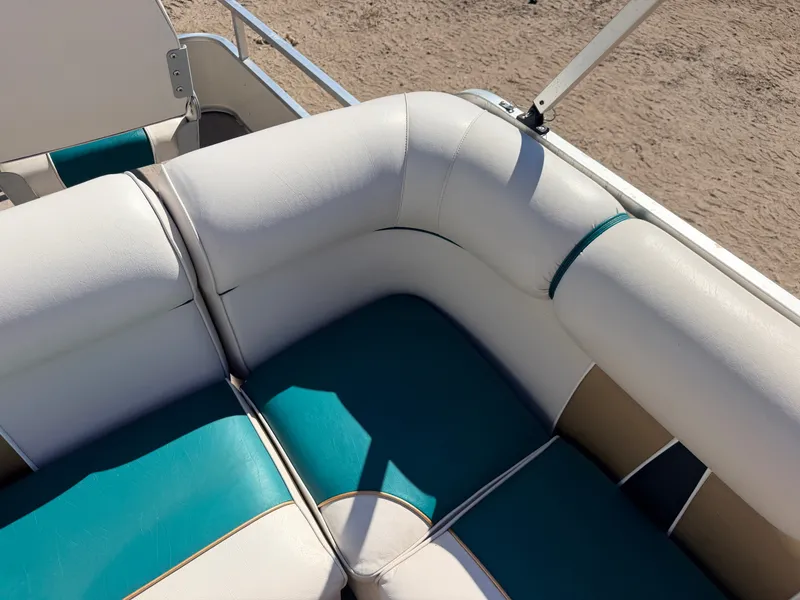 Slide: The Image of Close-up of a boat seat with white and turquoise upholstery. - 27