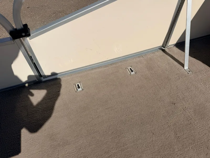 Slide: The Image of Close-up of a boat deck with beige carpeting and metal framing. - 17