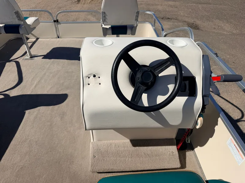 Slide: The Image of Helm of an Elete 2021 Party Fish with 50HP Yamaha engine, on a carpeted floor. - 21