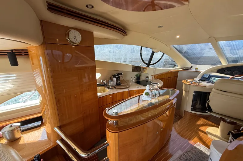 Slide: The Image of Luxurious interior of a 2008 Azimut 55E yacht with elegant wood finishes. - 14