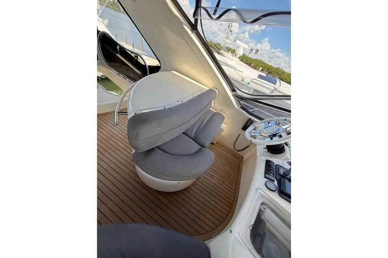 Slide: The Image of Interior of a 2008 Azimut 55E yacht with modern helm and seating. - 32