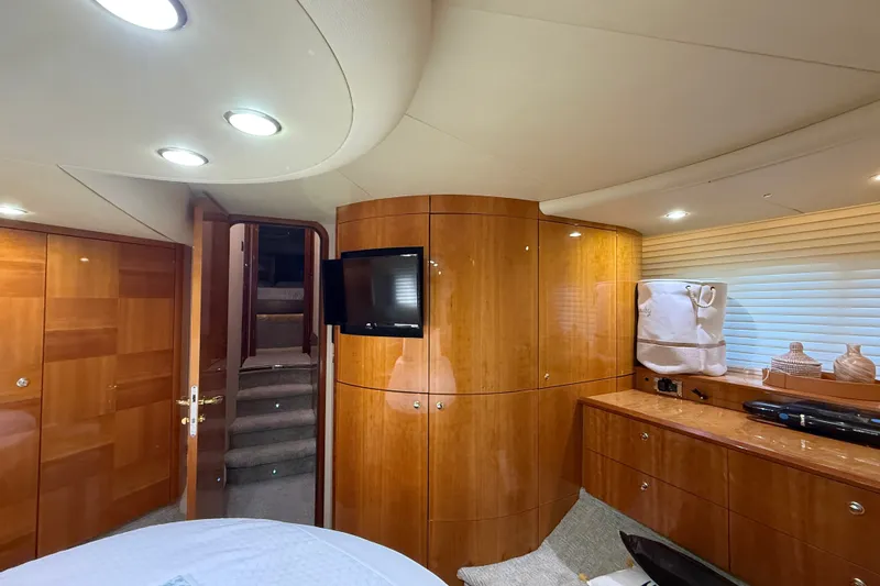 Slide: The Image of Luxurious interior of a 2008 Azimut 55E yacht with elegant wood finishes and modern amenities. - 23