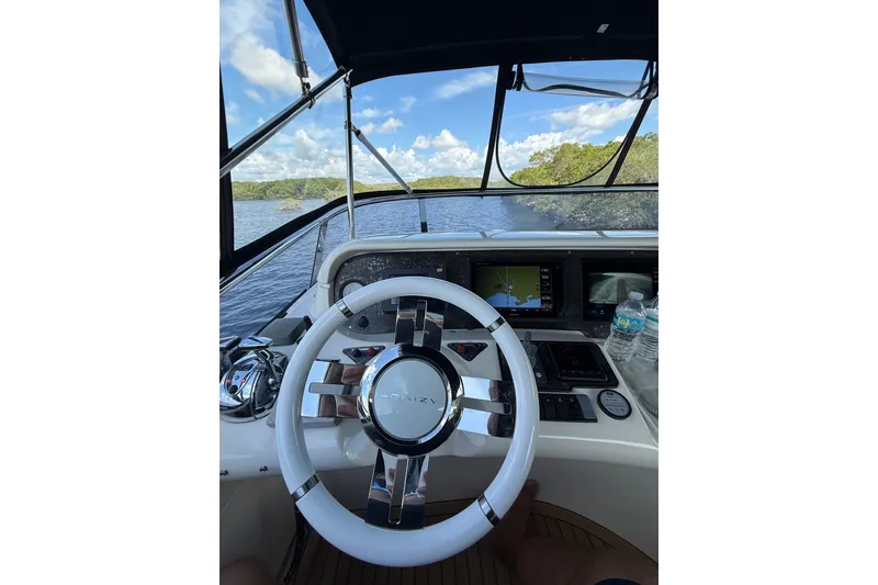 Slide: The Image of Cockpit view of 2008 Azimut 55E yacht with steering wheel and navigation system. - 30