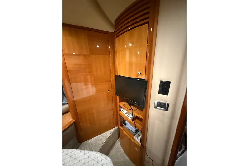 Slide: The Image of Interior of 2008 Azimut 55E yacht with wooden cabinetry and mounted TV. - 27