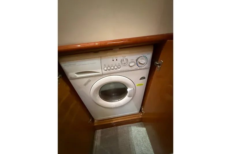 Slide: The Image of Washing machine inside 2008 Azimut 55E yacht, wooden cabinet enclosure. - 25