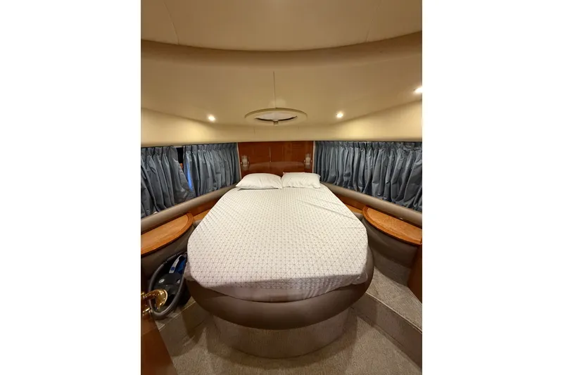 Slide: The Image of Luxurious bedroom interior of 2008 Azimut 55E yacht with cozy bed and elegant decor. - 26