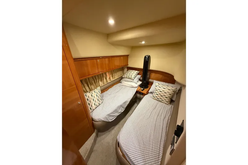 Slide: The Image of Twin cabin interior of 2008 Azimut 55E yacht with cozy bedding and wooden accents. - 28