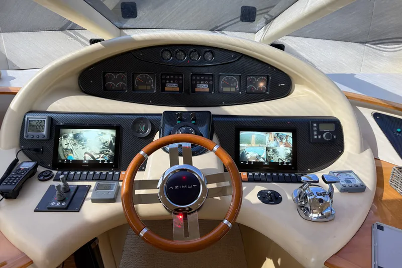 Slide: The Image of Cockpit of 2008 Azimut 55E yacht with advanced navigation controls and displays. - 16