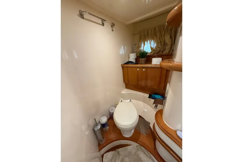 Slide: The Image of Luxurious bathroom in 2008 Azimut 55E yacht with elegant wood cabinetry and modern fixtures. - 21