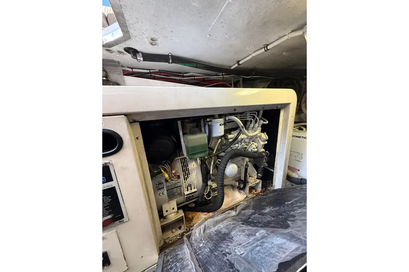 Slide: The Image of Engine compartment of a 2008 Azimut 55E yacht, showcasing mechanical components and wiring. - 37