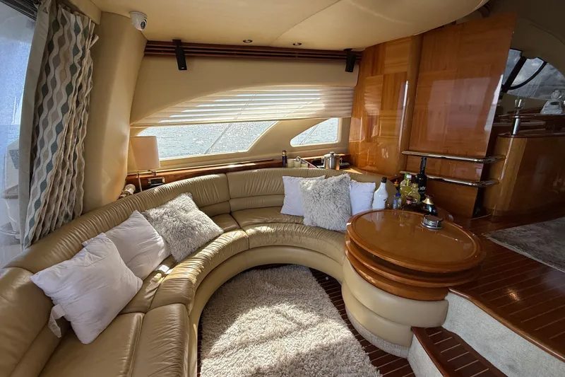 Slide: The Image of Luxurious interior of a 2008 Azimut 55E yacht with plush seating and elegant decor. - 13