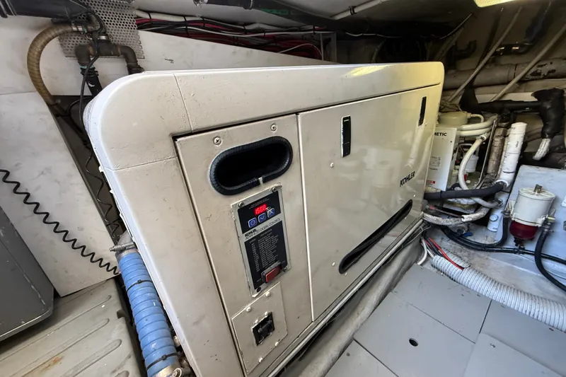 Slide: The Image of Engine room of a 2008 Azimut 55E yacht featuring a Kohler generator. - 36