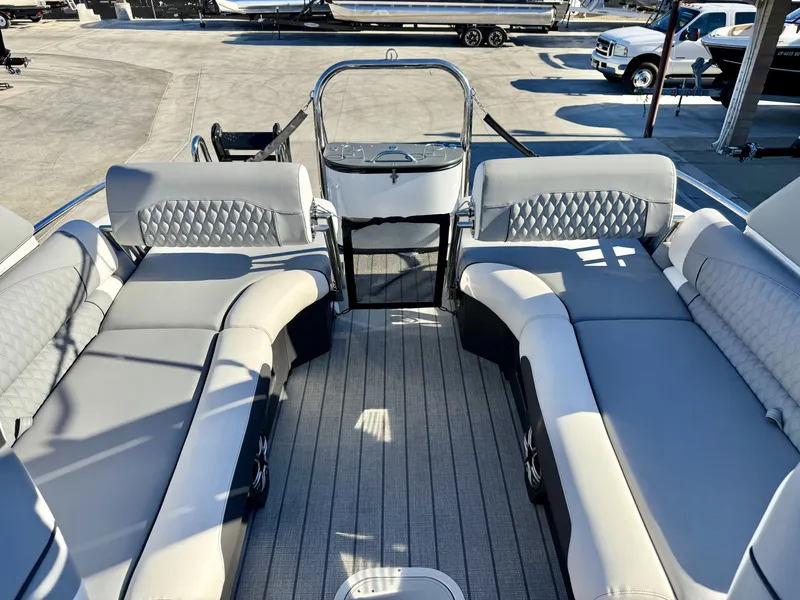 Slide: The Image of Luxurious seating and modern design in the Avalon Excalibur 27' LTD Quad Lounge with windshield. - 11