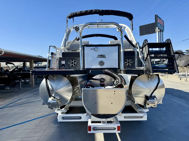 Slide: The Image of Rear view of an Avalon Excalibur 27' LTD Quad Lounge with 400HP, on a trailer. - 7