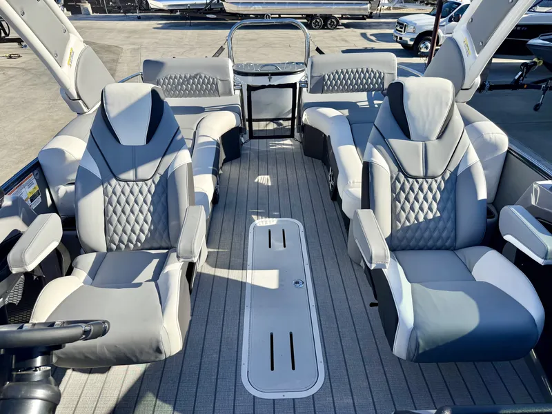 Slide: The Image of Luxurious interior of an Avalon Excalibur 27' LTD with sleek, upholstered seating and modern design. - 9