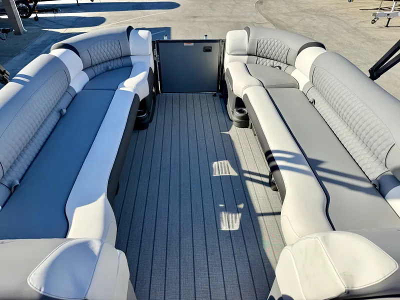 Slide: The Image of Interior view of a luxury pontoon boat with gray and white upholstery and spacious layout. - 10