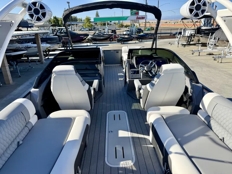 Slide: The Image of The image shows the interior of an Avalon Excalibur 27' LTD Quad Lounge with a sleek, modern design. - 13