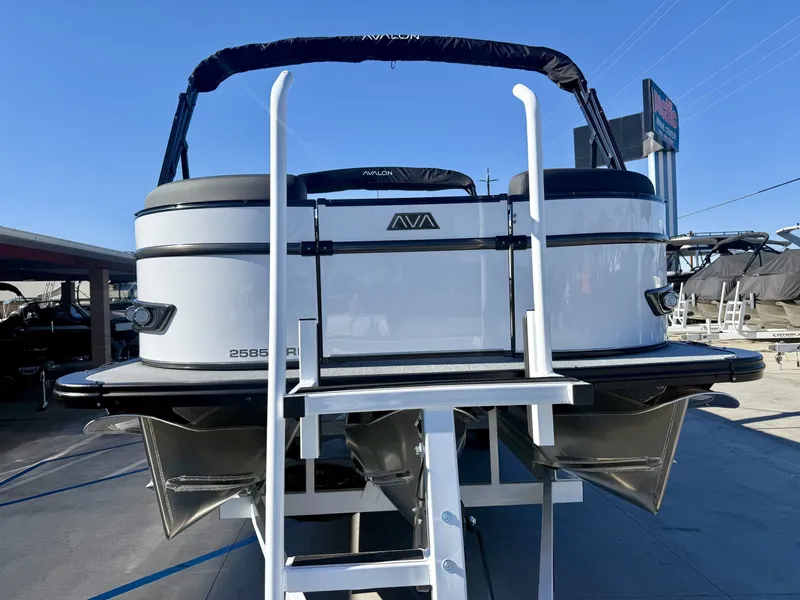 Slide: The Image of The image shows the rear of an Avalon 25' Catalina Platinum Versatile Rear Lounge boat with a ladder. - 2