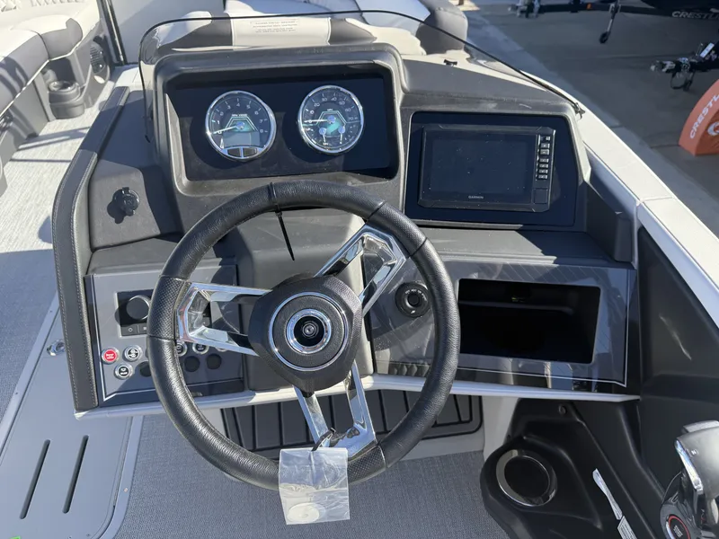 Slide: The Image of The image shows the helm of an Avalon boat with a modern steering wheel and instruments. - 15