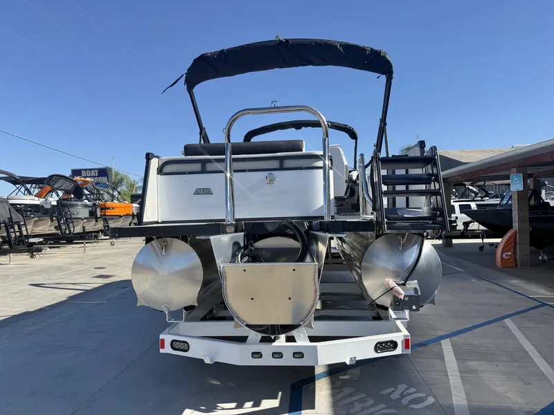 Slide: The Image of The image shows the rear of an Avalon 25' Catalina Platinum Versatile Rear Lounge boat with a 250HP Mercury Verado engine. - 5