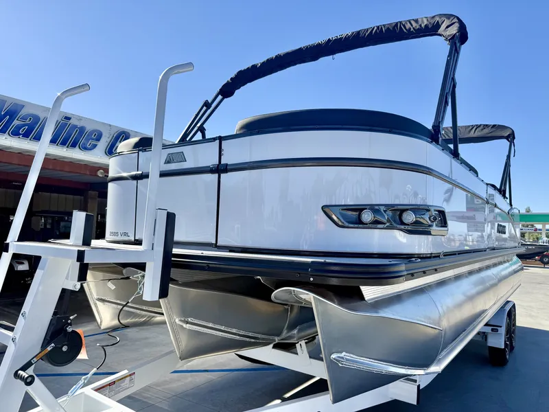 Slide: The Image of A luxurious Avalon 25' Catalina Platinum boat with a 250HP Mercury Verado engine, on a trailer. - 3
