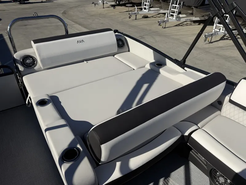 Slide: The Image of The image shows a luxurious lounge area on an Avalon boat, surrounded by cup holders. - 7