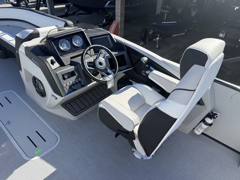 Slide: The Image of The image shows the cockpit of an Avalon 25' Catalina Platinum with a modern helm and comfortable seating. - 16