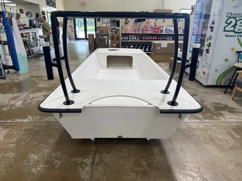 Slide: The Image of The image shows a Delta Boatworks DELTA 1550 boat from 2027 in a showroom. - 8