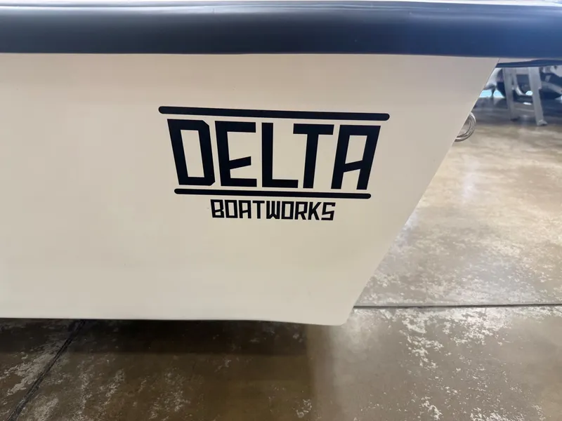 Slide: The Image of Close-up of the Delta Boatworks logo on a white boat hull. - 7