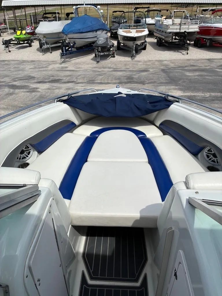 Slide: The Image of The image shows the bow area of a 2007 Crownline 270BR boat with blue and white upholstery. - 8