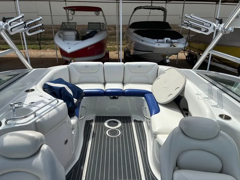 Slide: The Image of The image shows the cockpit of a 2007 Crownline 270BR boat with white and blue seating. - 3