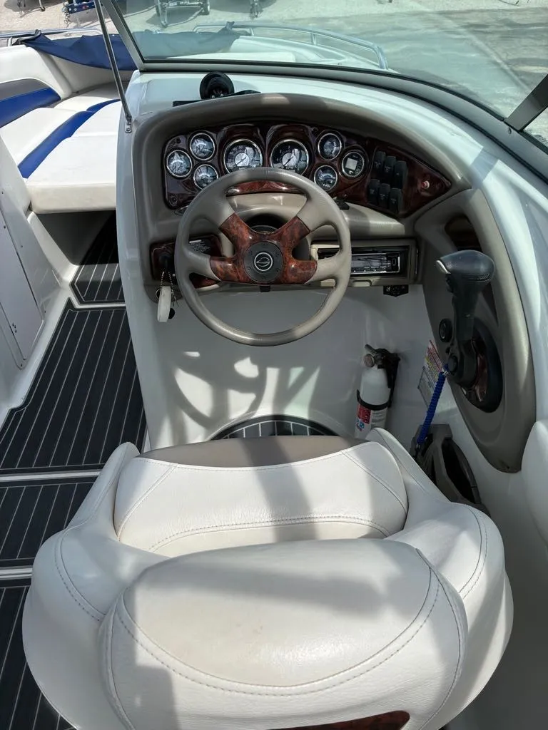 Slide: The Image of The image shows the cockpit of a 2007 Crownline 270BR boat with a stylish steering wheel and instruments. - 6