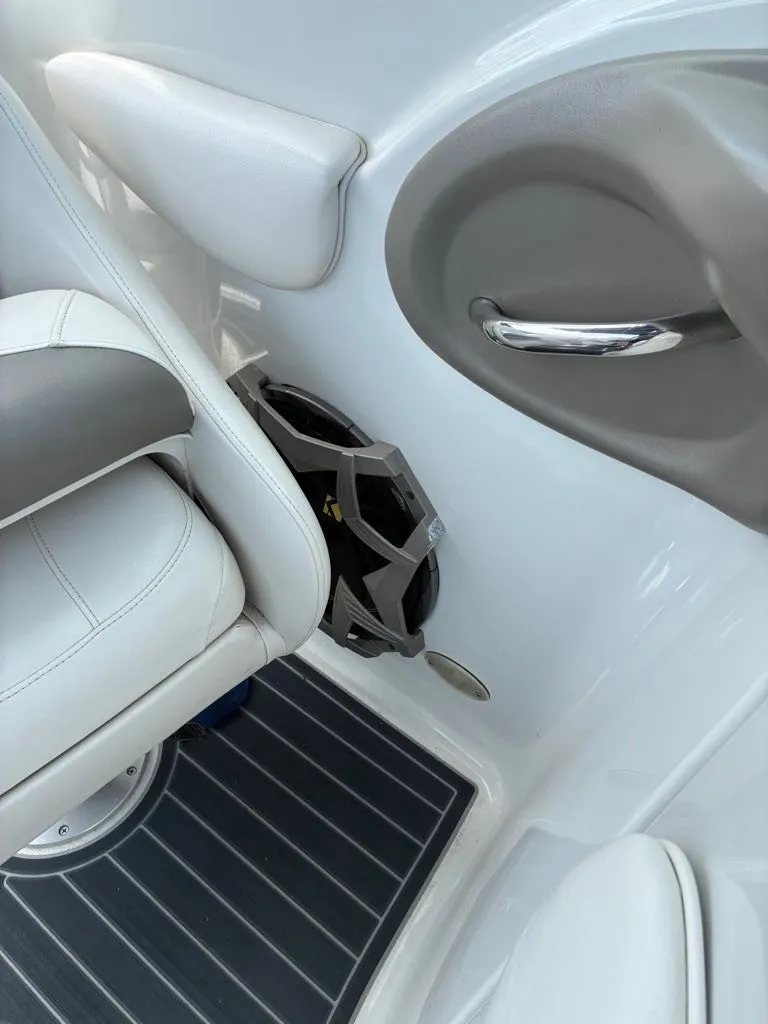 Slide: The Image of Close-up of a white boat seat with gray accents and a cup holder on the side. - 4