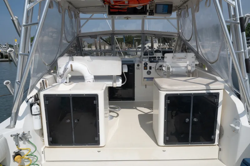 Slide: The Image of 2001 Carolina Classic 28 Express boat interior with seating and control panel. - 8