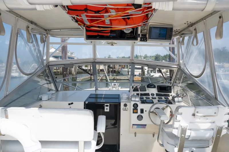Slide: The Image of Interior view of a 2001 Carolina Classic 28 Express boat cockpit with navigation equipment. - 4