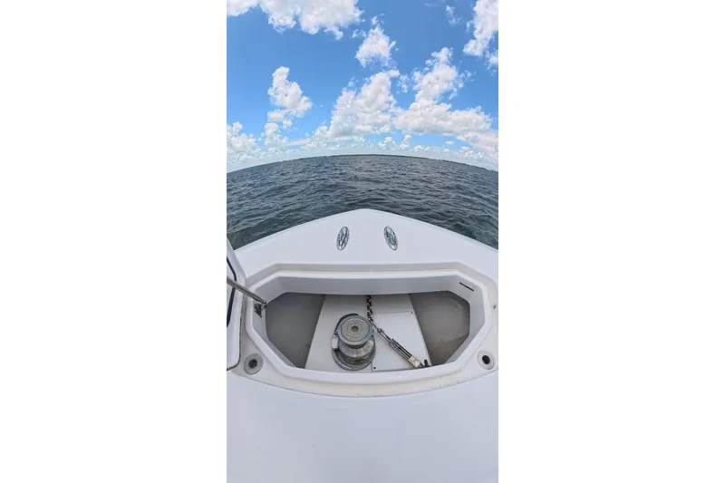 Slide: The Image of Bow view of 2013 Invincible 42 Open Fisherman on open water under blue sky. - 13
