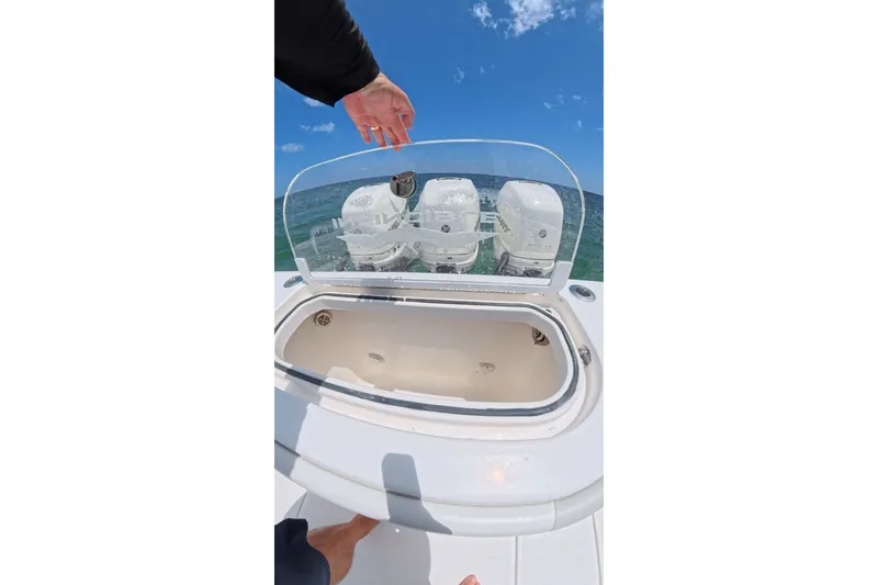 Slide: The Image of 2013 Invincible 42 Open Fisherman boat with open hatch and ocean view. - 24