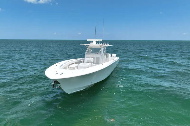 Slide: The Image of 2013 Invincible 42 Open Fisherman boat on open sea under clear blue sky. - 7