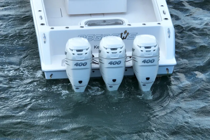Slide: The Image of 2013 Invincible 42 Open Fisherman with triple 400 horsepower engines on water. - 8