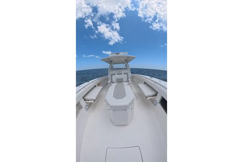 Slide: The Image of 2013 Invincible 42 Open Fisherman boat on open sea under clear blue sky. - 16