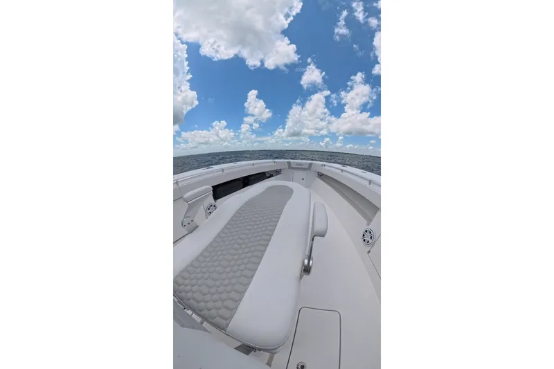 Slide: The Image of 2013 Invincible 42 Open Fisherman boat on open sea under cloudy sky. - 32
