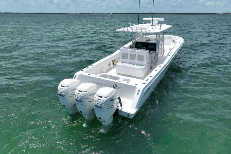 Slide: The Image of 2013 Invincible 42 Open Fisherman boat with triple 400 horsepower engines on open water. - 4