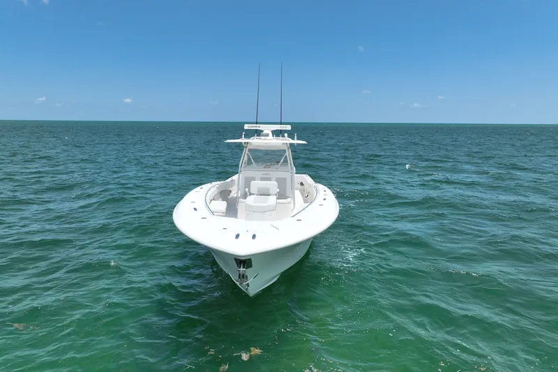 Slide: The Image of 2013 Invincible 42 Open Fisherman boat on open sea under clear blue sky. - 6
