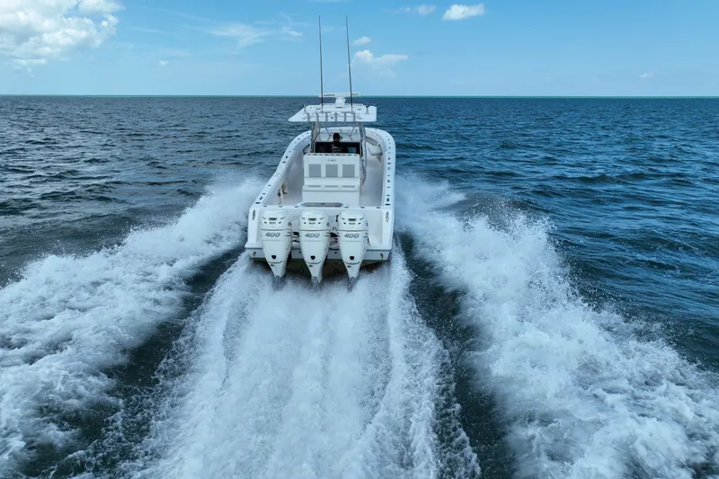 Slide: The Image of 2013 Invincible 42 Open Fisherman speeding on open ocean waters. - 9