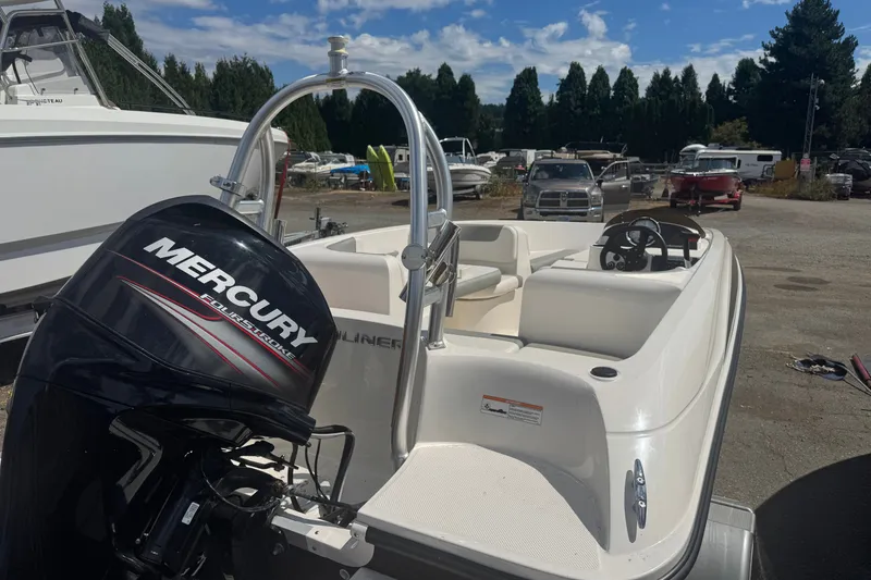 Slide: The Image of 2014 Bayliner 160 Element boat with Mercury engine in a marina setting. - 7