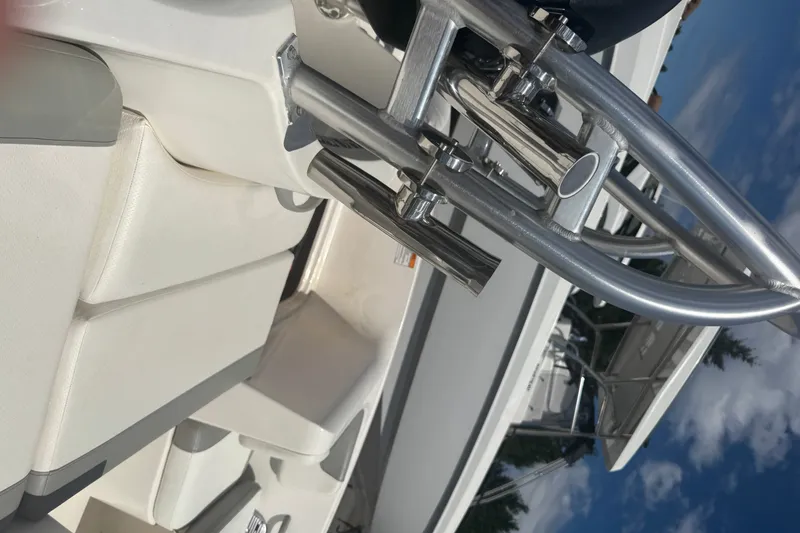 Slide: The Image of 2014 Bayliner 160 Element boat interior with stainless steel fittings and white seating. - 5