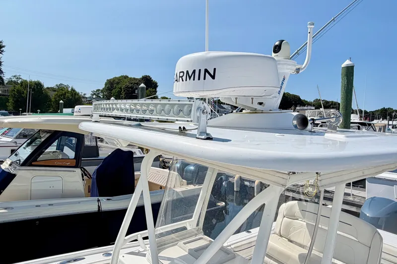 Slide: The Image of A 2014 Buddy Davis 28 Center Console with Garmin radar and LED bar on the roof. - 20